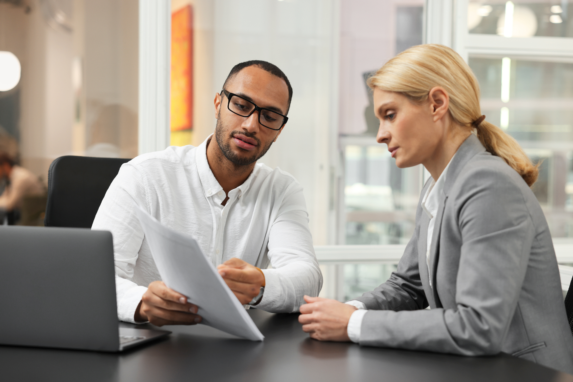 Employer representative reviewing a regulatory compliance notice with an adviser