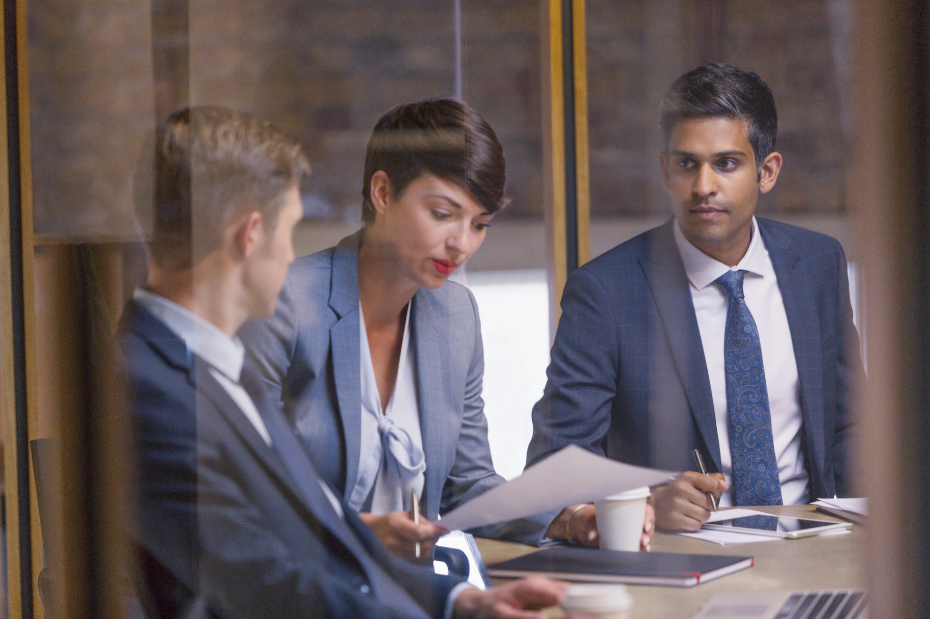 HR leader reviewing organisational restructure documentation