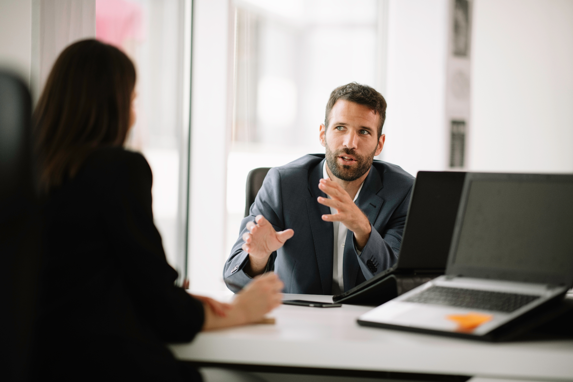 Return-to-work coordinator discussing a rehabilitation plan with a manager