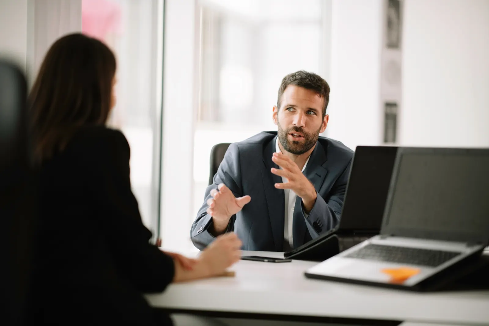 Return-to-work coordinator discussing a rehabilitation plan with a manager