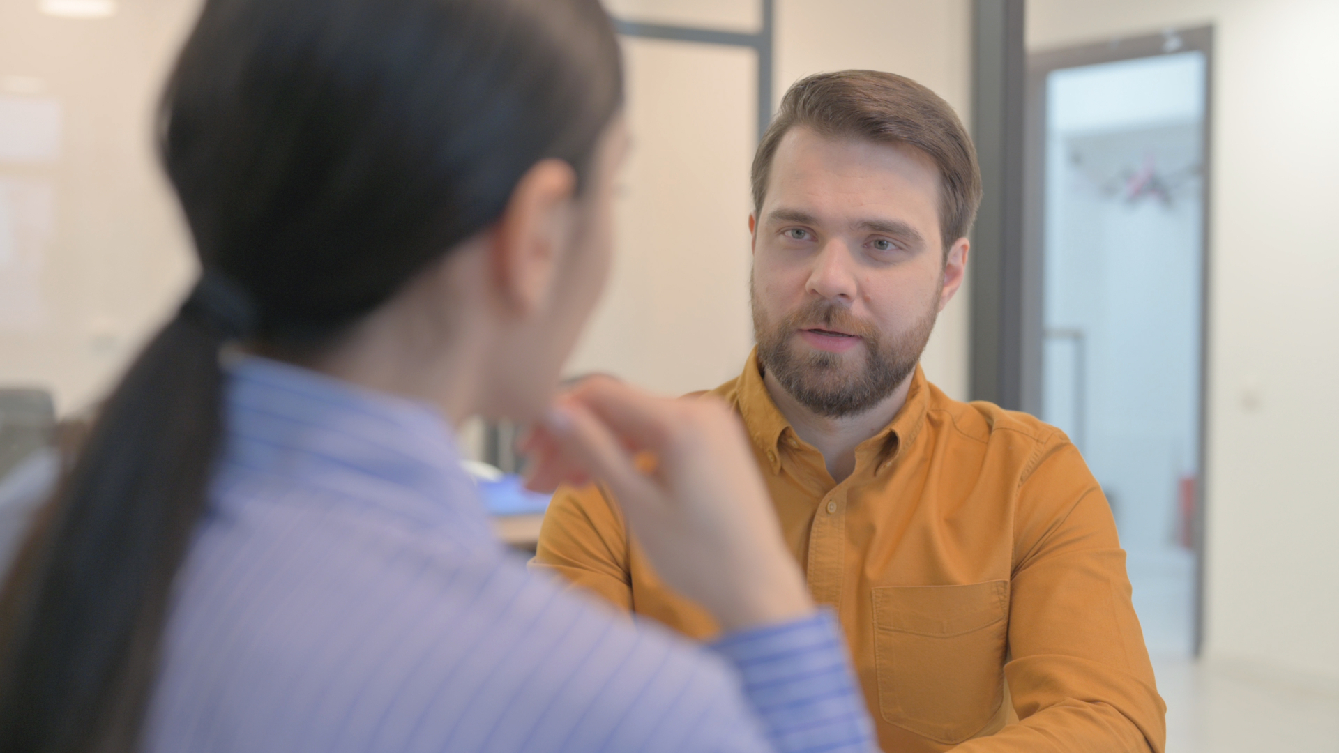 HR consultant meeting confidentially with an employee about a workplace complaint